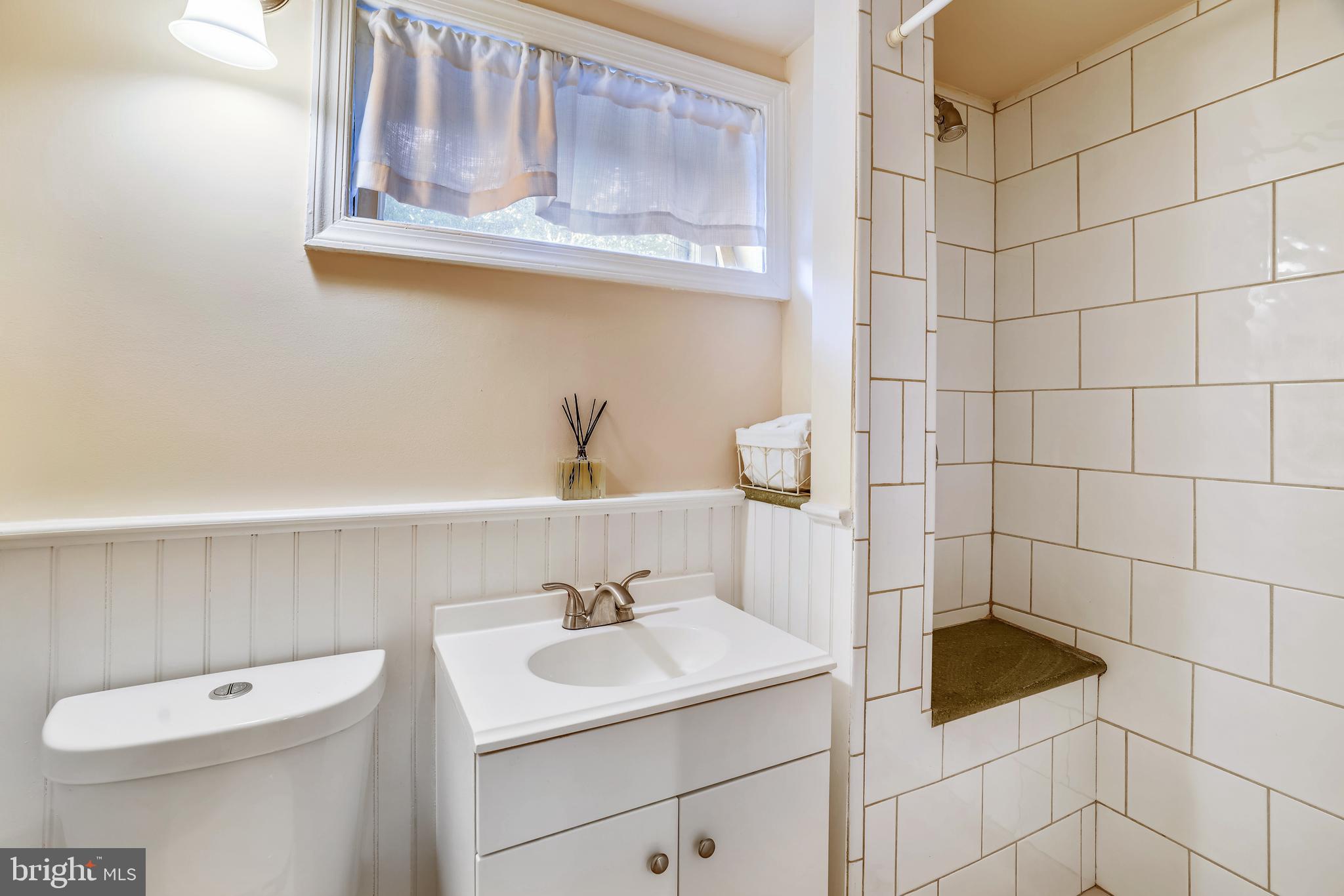 2500 Q Street Northwest, Unit 246 Washington, DC 20007 - Photo 5 of 26 Wainscotting adorned bath