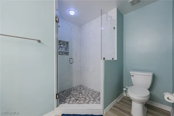 a view of residential house with outdoor space and lake view