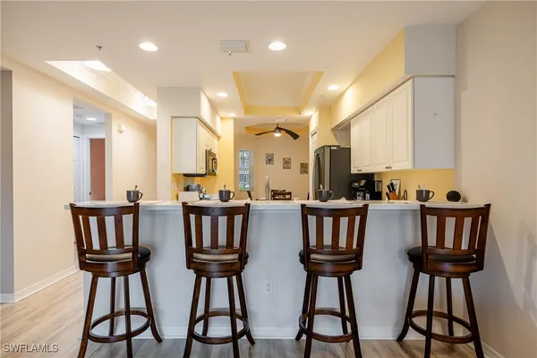 a kitchen with stainless steel appliances a stove microwave and cabinets