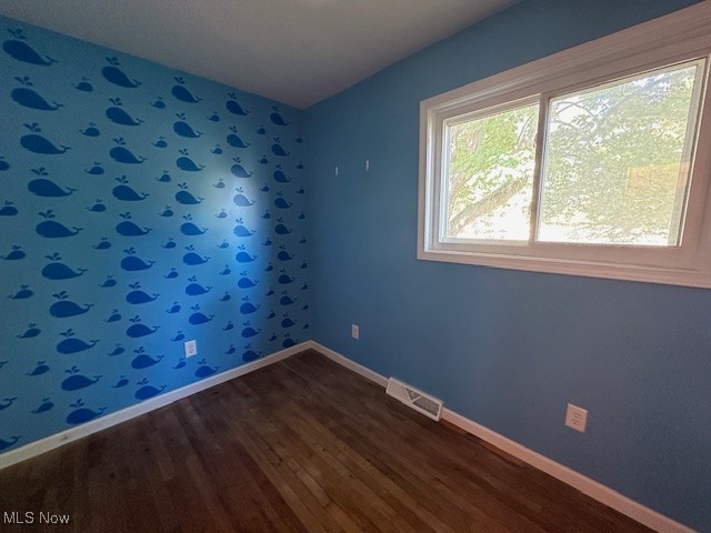 3216 South Ridge Road West Ashtabula, OH 44004 - Photo 10 of 17 Spare room with wood-type flooring