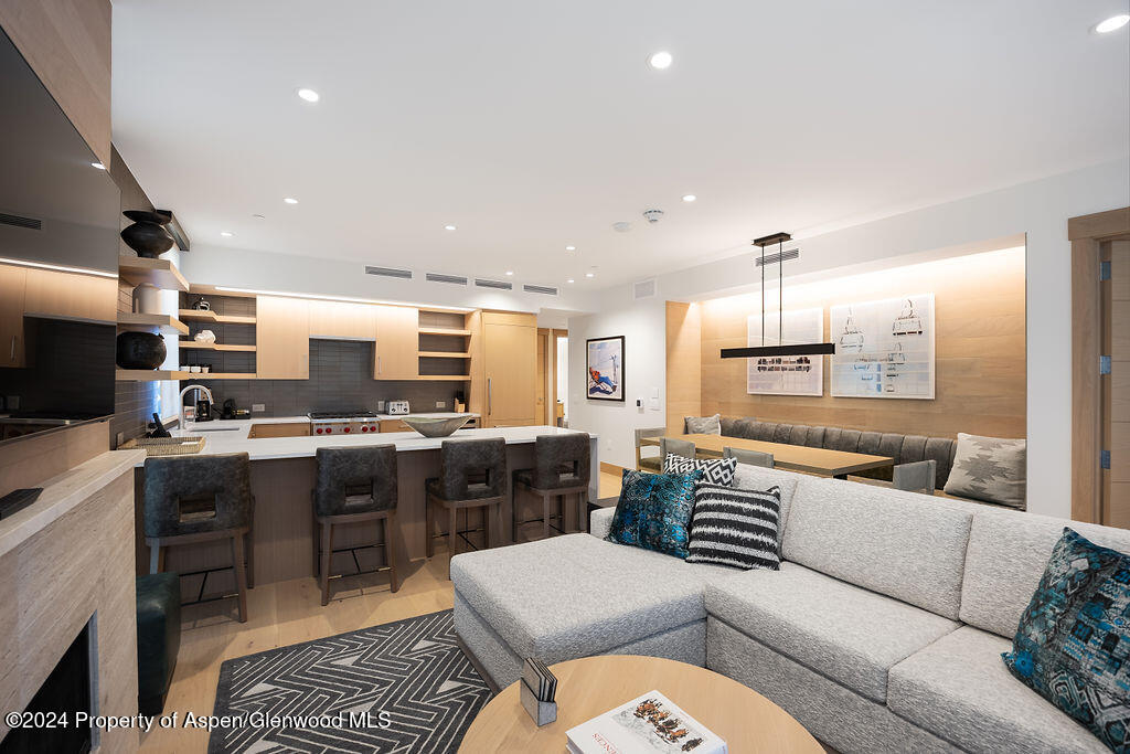 130 Wood Road, Unit 464 Snowmass Village, CO 81615 - Photo 1 of 19 a living room with stainless steel appliances furniture and a kitchen view