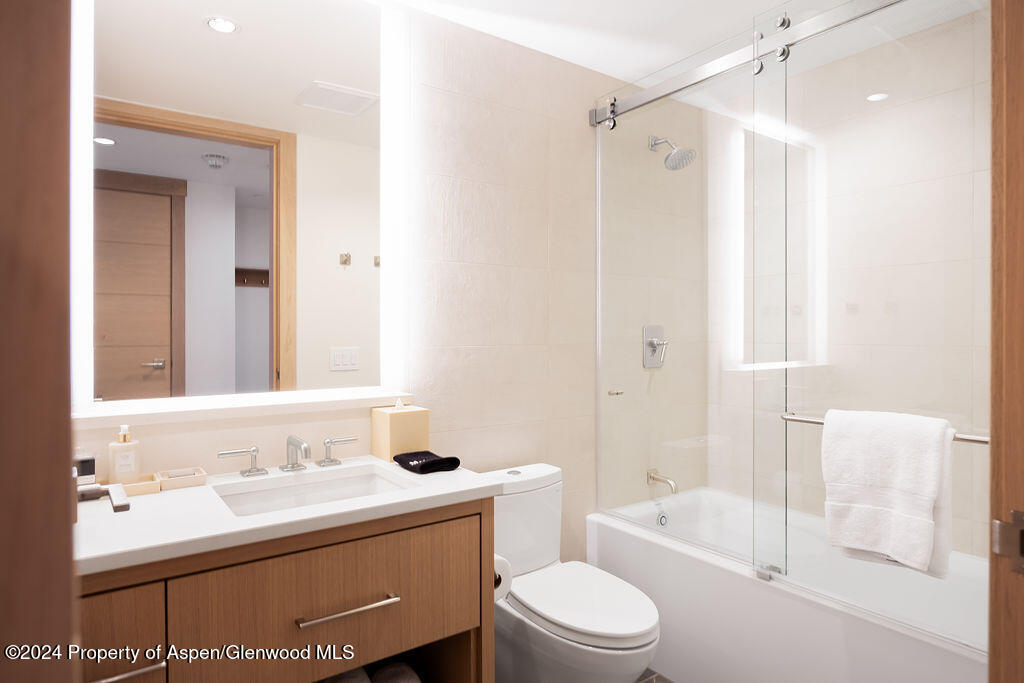 130 Wood Road, Unit 464 Snowmass Village, CO 81615 - Photo 15 of 19 a bathroom with a sink toilet and shower