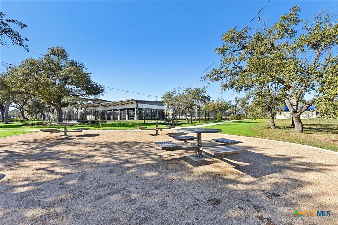 217 Firefox Way Jarrell, TX 76537 - Photo 6 of 8 a view of backyard with swimming pool and green space