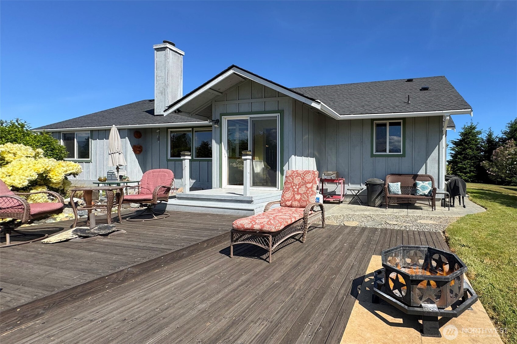 101 Timothy Lane Sequim, WA 98382 - Photo 28 of 39 a backyard of a house with seating space