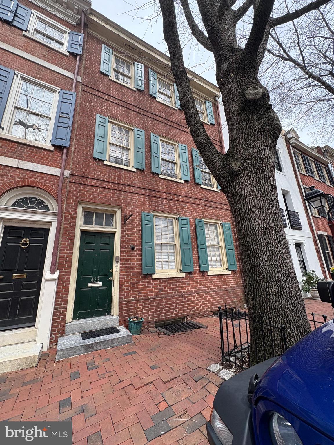 a view of a brick building with many windows