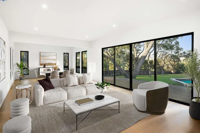 a living room with couch and a large window