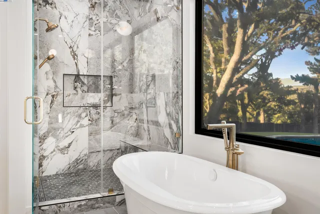 a white bath tub sitting in a bathroom