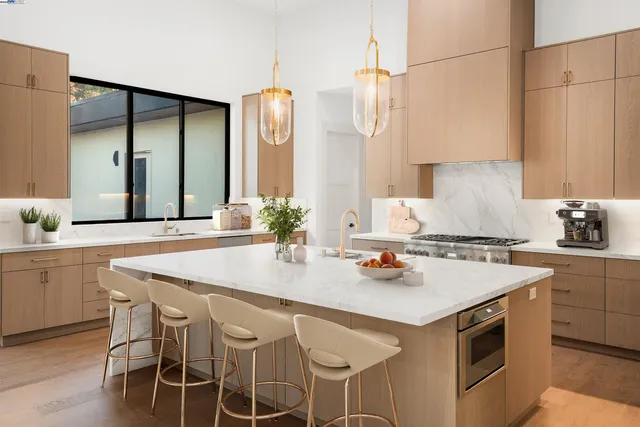 a kitchen with a stove a sink and a refrigerator