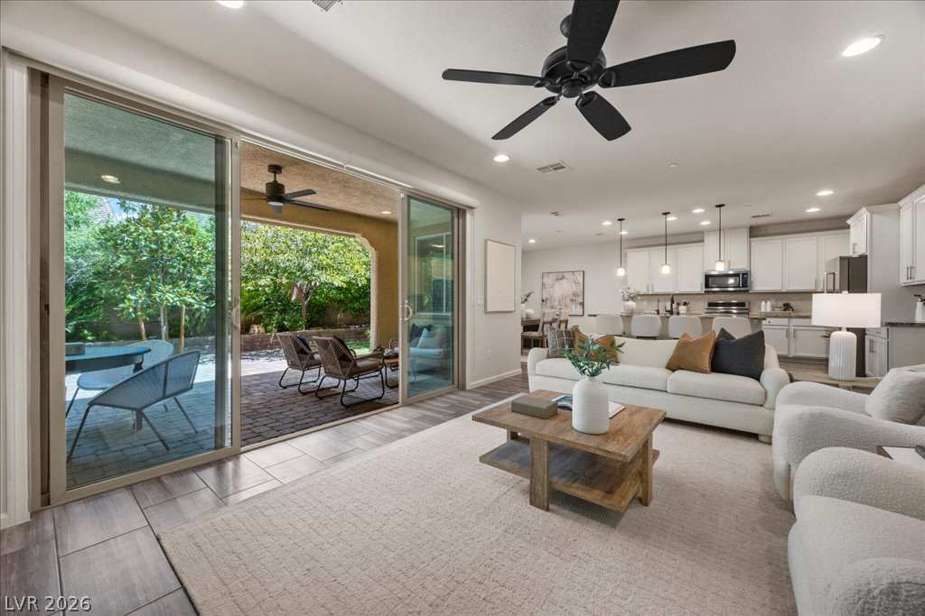 2572 Sable Ridge Street Henderson, NV 89044 - Photo 15 of 83 The living room opens up nicely to the Gorgeous patio & backyard!