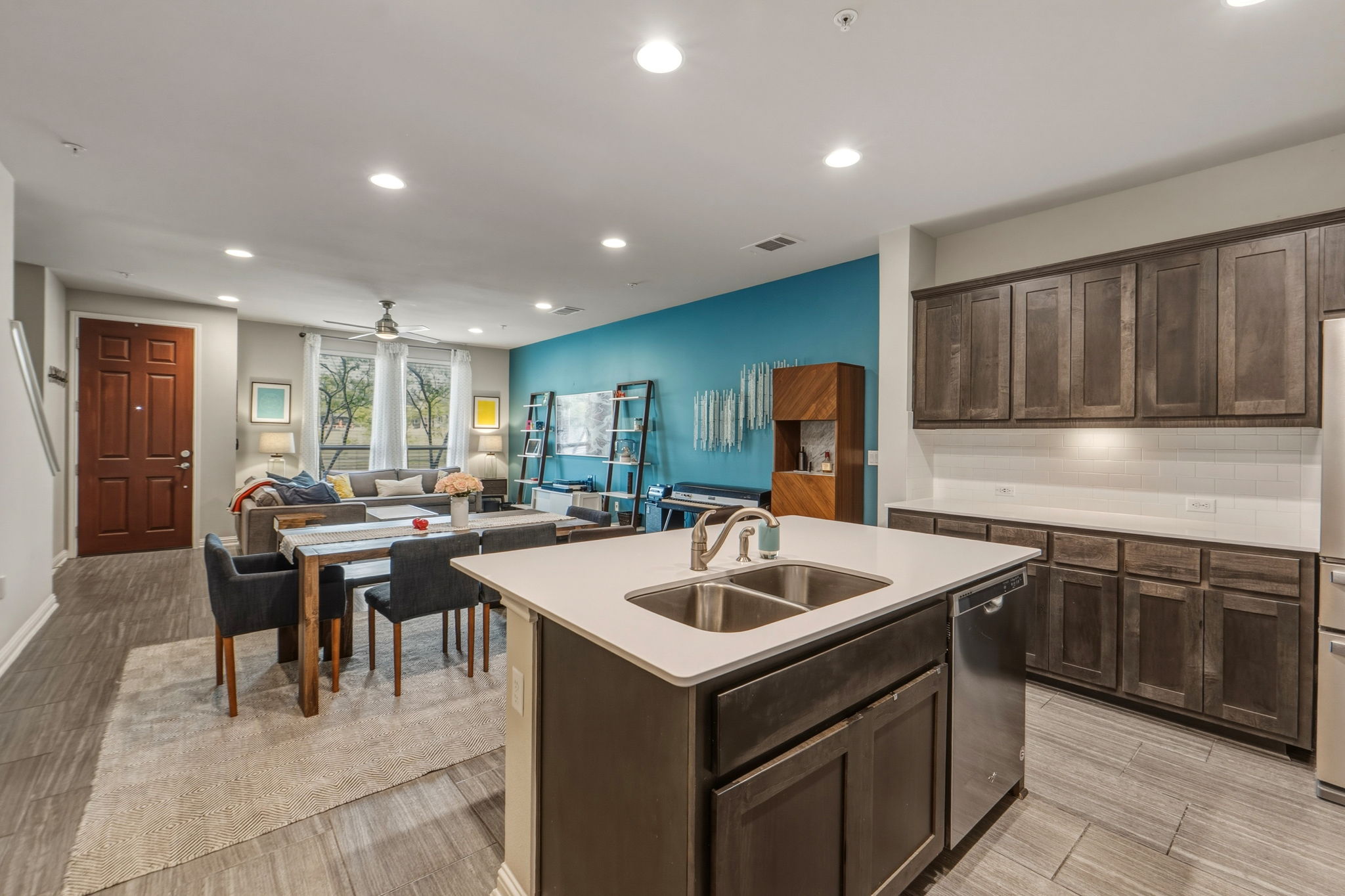 6814 East Riverside Drive, Unit 34 Austin, TX 78741 - Photo 10 of 26 a kitchen that has a sink a table and chairs in it