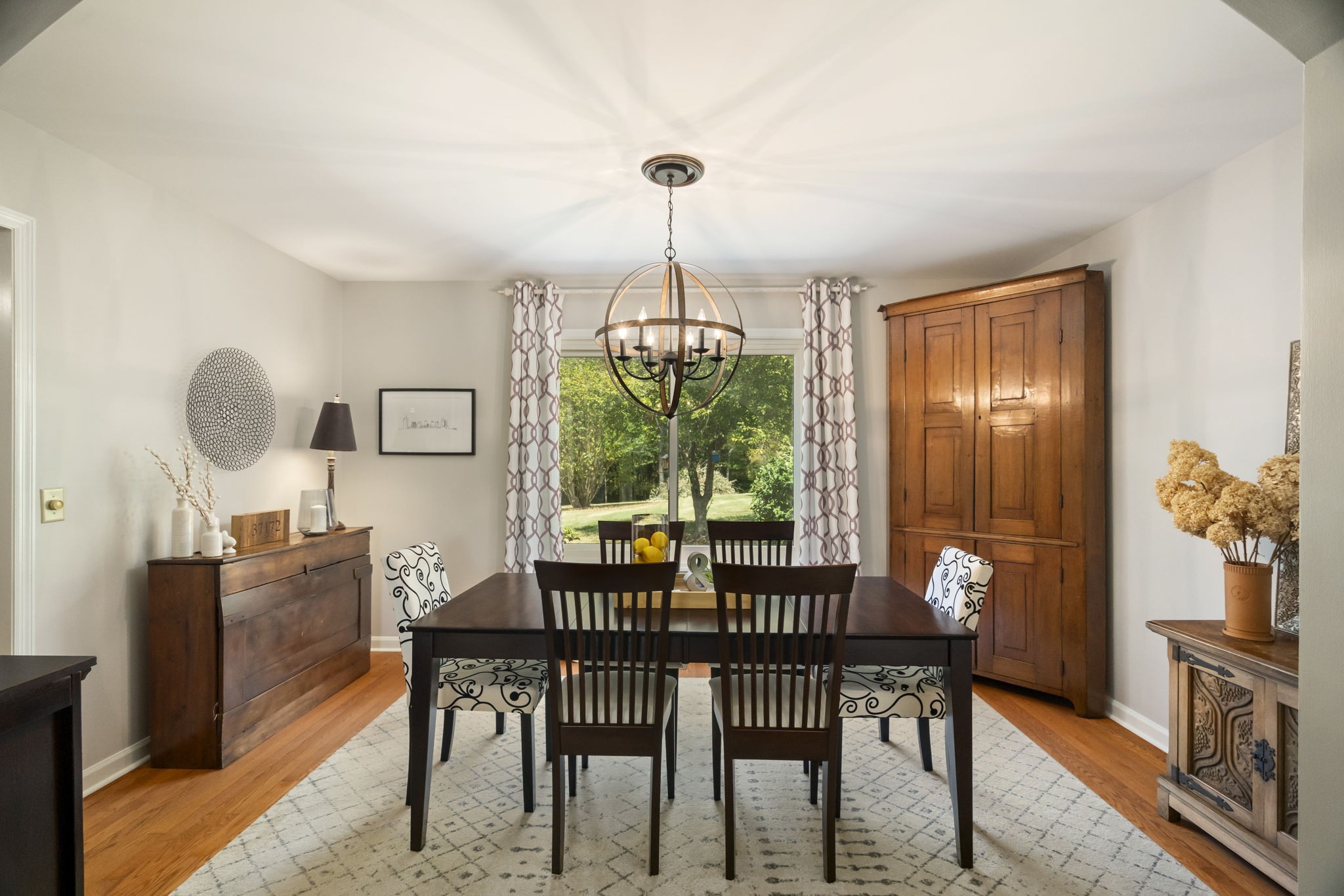 4926 Mt Zion Road Springfield, TN 37172 - Photo 15 of 48 a dining room with furniture a chandelier and wooden floor