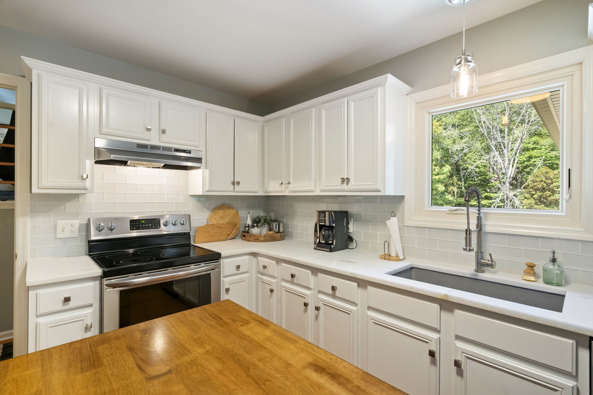 4926 Mt Zion Road Springfield, TN 37172 - Photo 26 of 48 a kitchen with granite countertop white cabinets and appliances