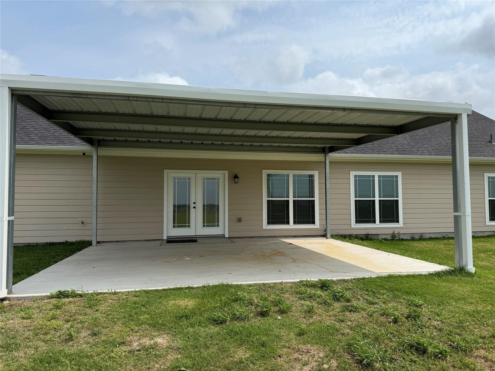 723 Sandy Corner Road El Campo, TX 77437 - Photo 3 of 20 Brand new covered patio to enjoy the sunset.