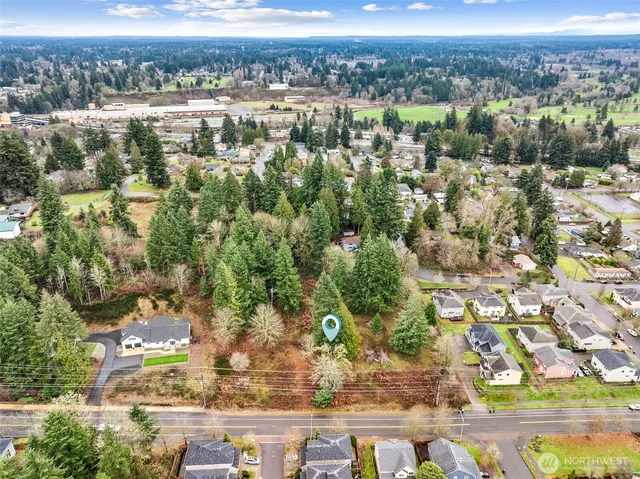 an aerial view of residential building and trees