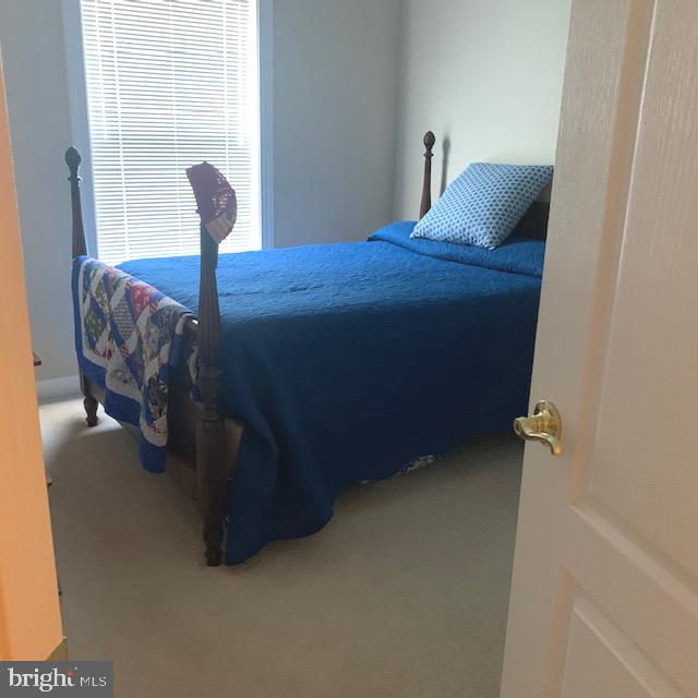 4097 River Forth Drive Fairfax, VA 22030 - Photo 13 of 18 a bed sitting in a bedroom next to a window