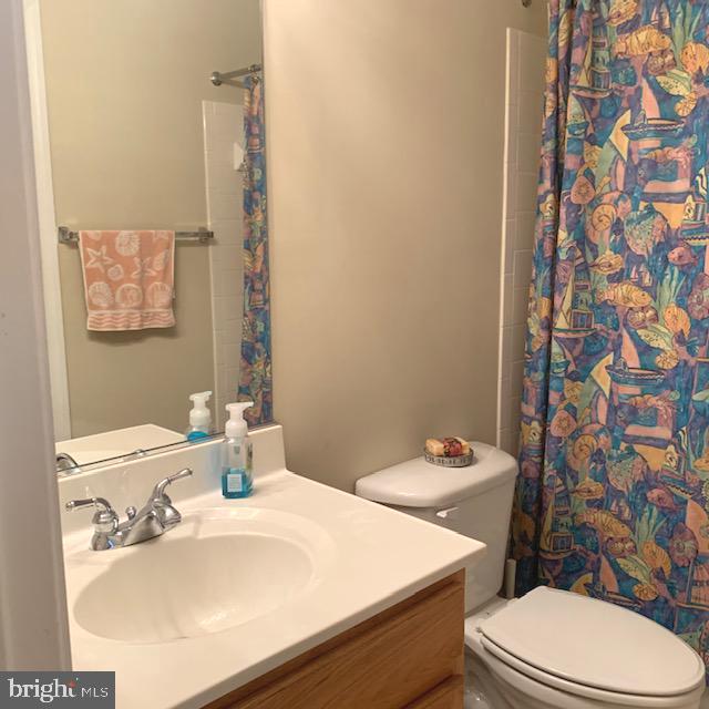 4097 River Forth Drive Fairfax, VA 22030 - Photo 15 of 18 a bathroom with a sink a toilet and a mirror