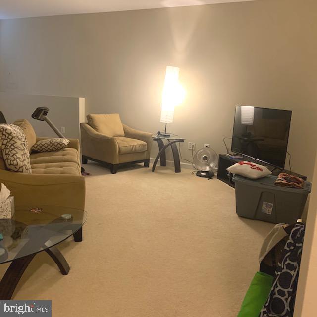 4097 River Forth Drive Fairfax, VA 22030 - Photo 16 of 18 a living room with furniture and a flat screen tv