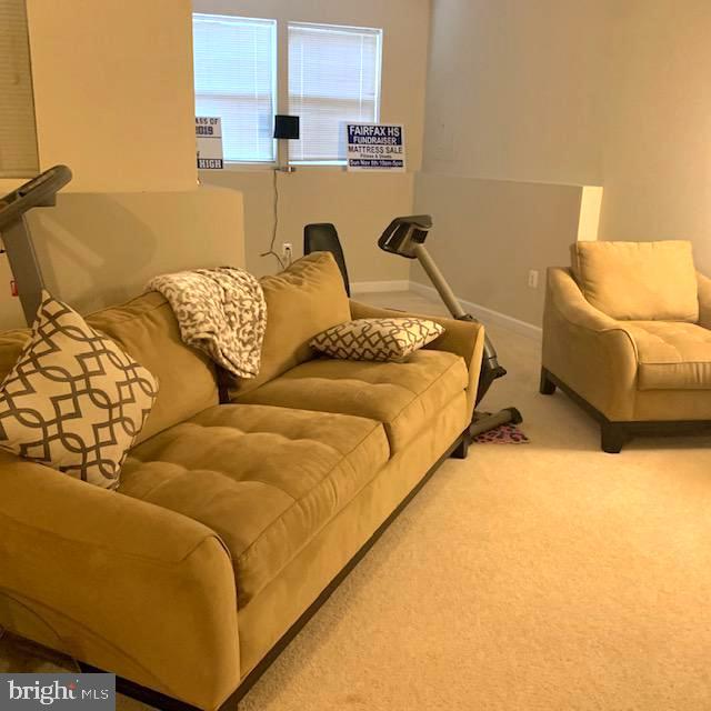 4097 River Forth Drive Fairfax, VA 22030 - Photo 17 of 18 a bed sitting in a bedroom next to a lamp