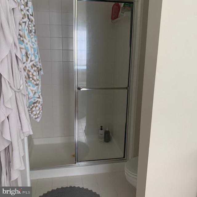 4097 River Forth Drive Fairfax, VA 22030 - Photo 18 of 18 a bathroom with a glass shower door