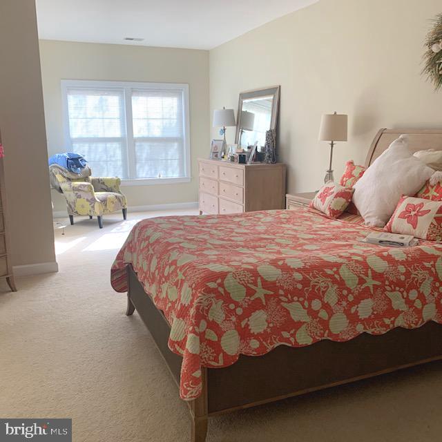 4097 River Forth Drive Fairfax, VA 22030 - Photo 8 of 18 a bed sitting in a bedroom next to a window with lamp