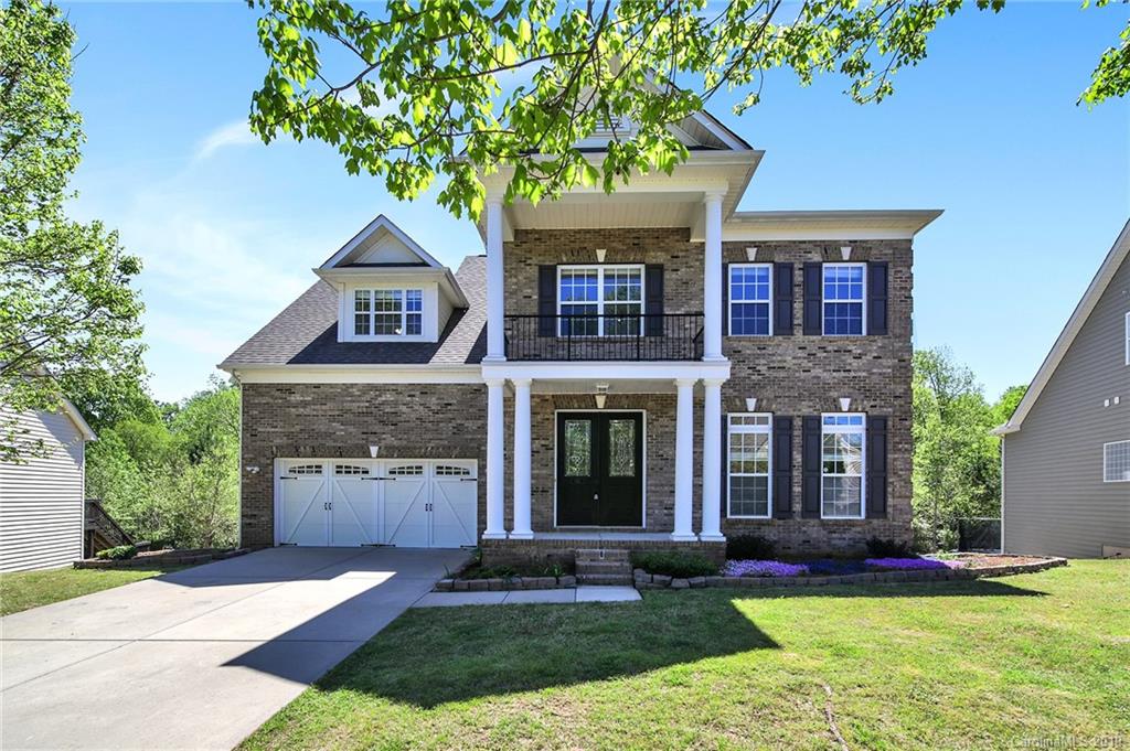 866 Treasure Court Fort Mill, SC 29708 - Photo 1 of 38 a front view of a house with a yard and garage