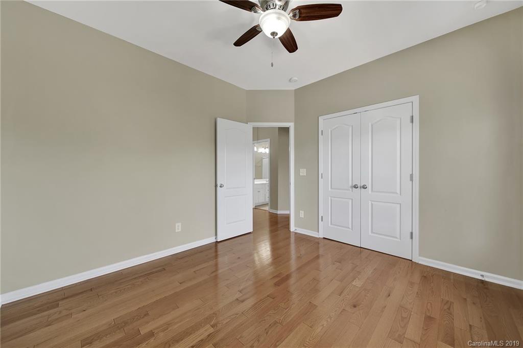 866 Treasure Court Fort Mill, SC 29708 - Photo 16 of 38 a view of an empty room with wooden floor