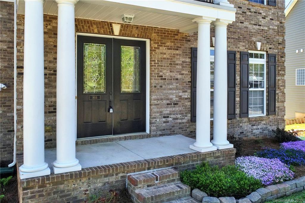866 Treasure Court Fort Mill, SC 29708 - Photo 3 of 38 a front view of a house with a yard