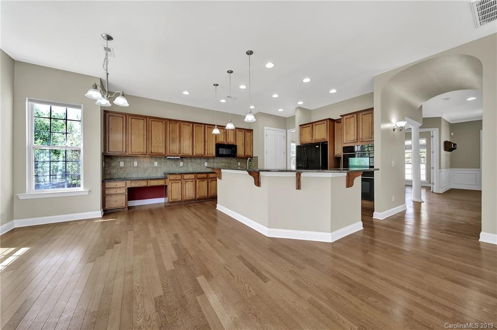866 Treasure Court Fort Mill, SC 29708 - Photo 21 of 38 a view of kitchen with wooden floor and window