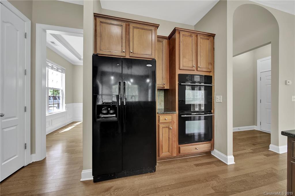 866 Treasure Court Fort Mill, SC 29708 - Photo 23 of 38 a view of a kitchen with wooden floor