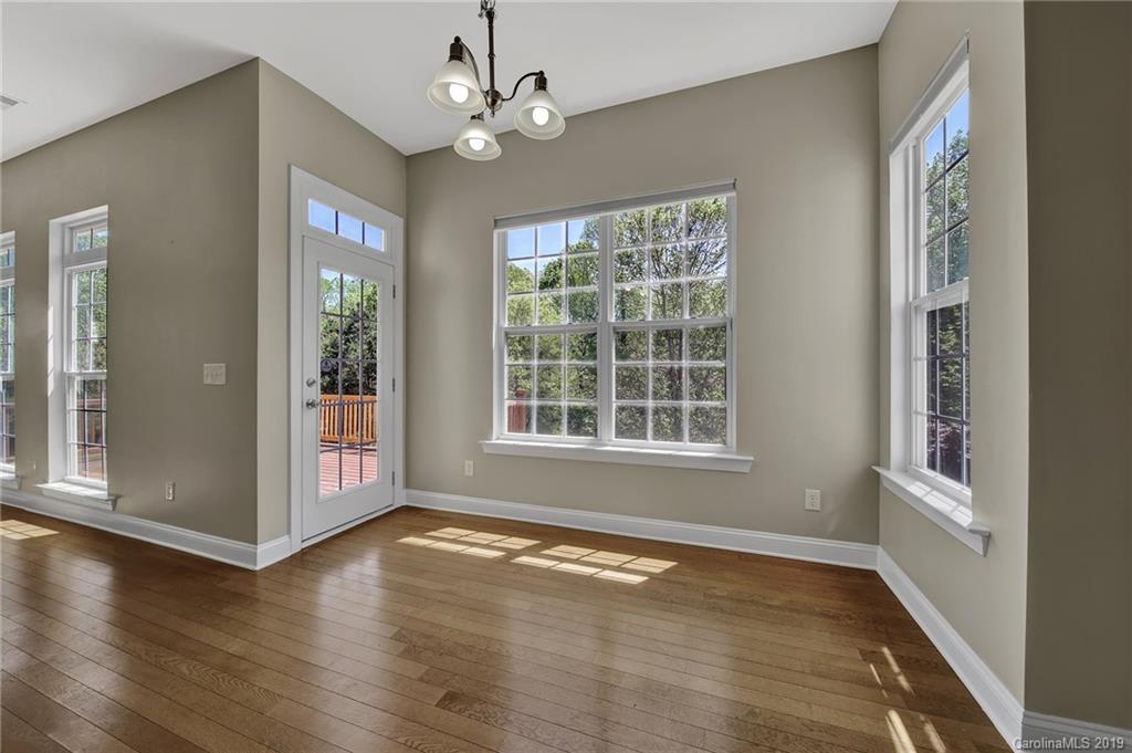 866 Treasure Court Fort Mill, SC 29708 - Photo 24 of 38 wooden floor in an empty room with a window