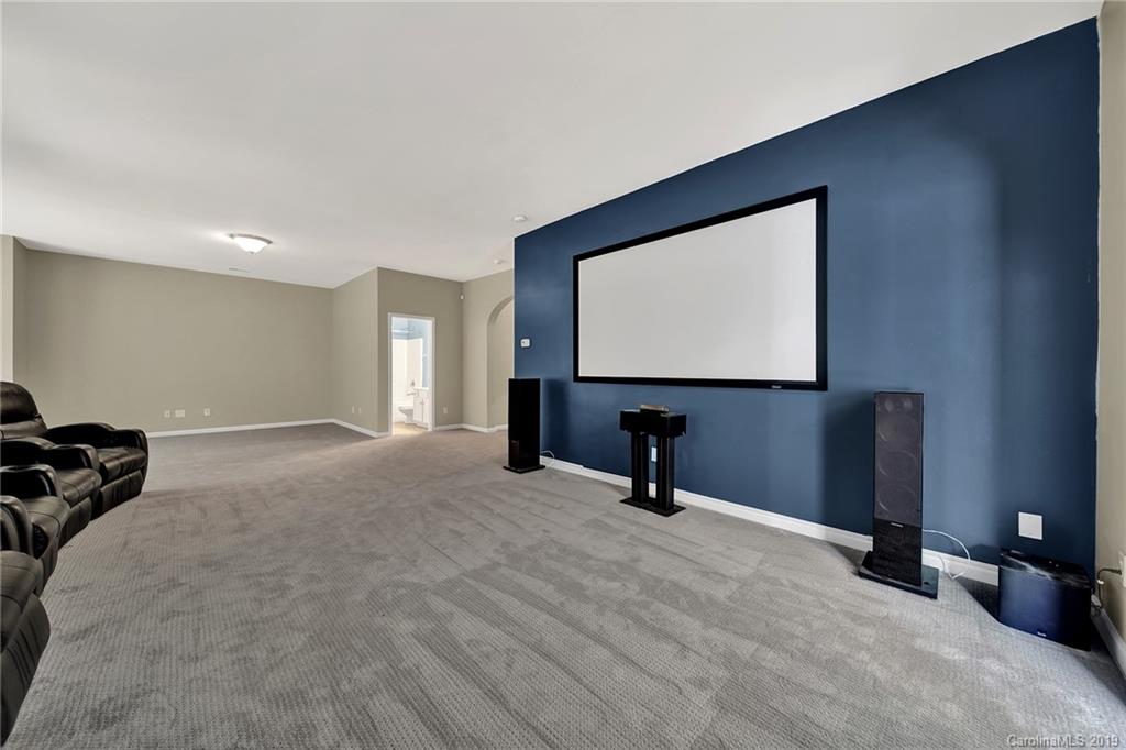 866 Treasure Court Fort Mill, SC 29708 - Photo 29 of 38 a room with a bed and a flat screen tv