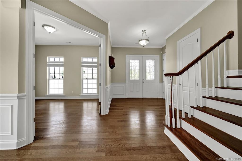 866 Treasure Court Fort Mill, SC 29708 - Photo 4 of 38 a view of an entryway with wooden floor and staircase