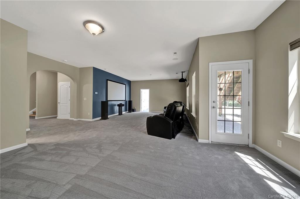 866 Treasure Court Fort Mill, SC 29708 - Photo 31 of 38 a living room with furniture window and a lamp