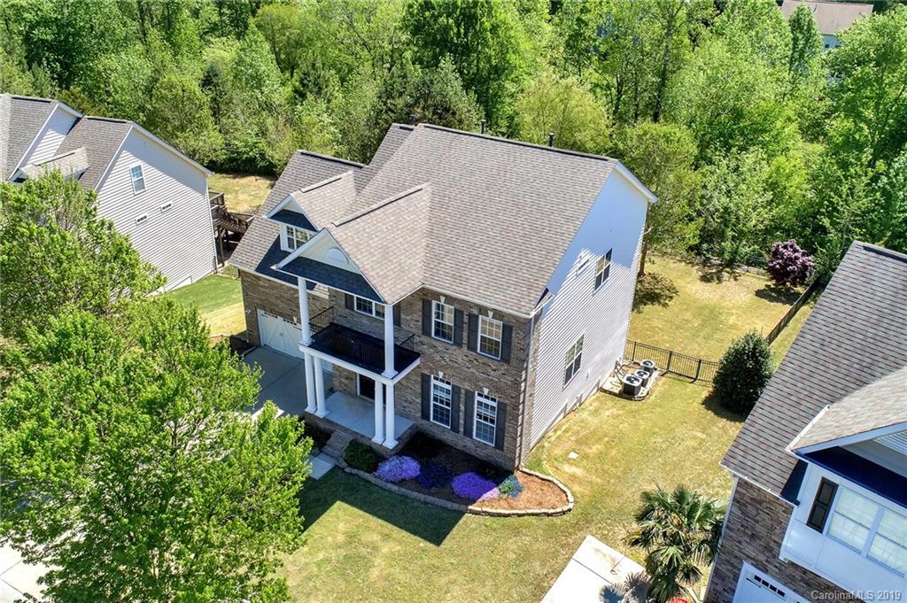 866 Treasure Court Fort Mill, SC 29708 - Photo 38 of 38 an aerial view of a house with swimming pool and large trees