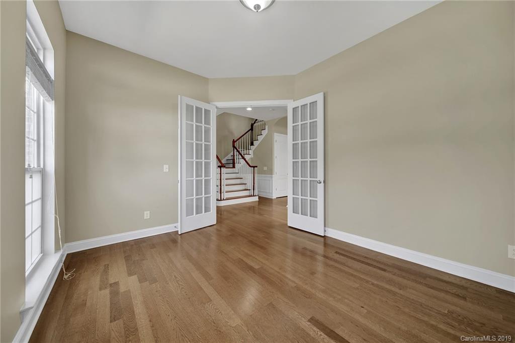 866 Treasure Court Fort Mill, SC 29708 - Photo 5 of 38 an empty room with wooden floor and windows