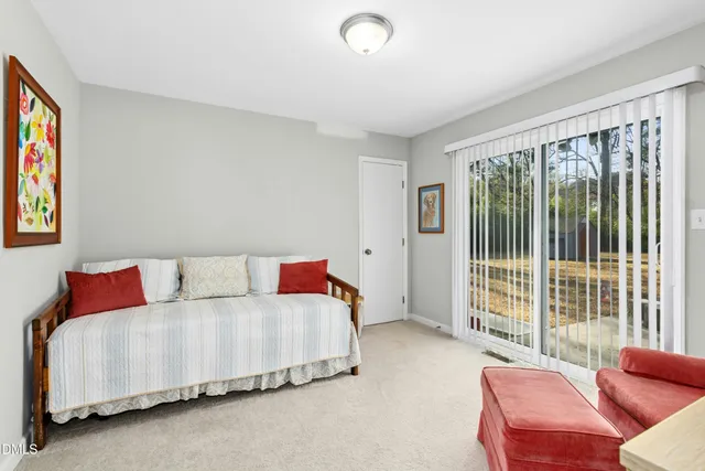 a dining room with furniture and windows
