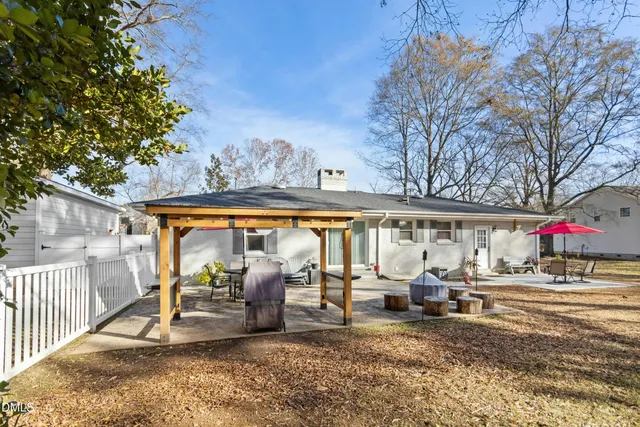a living room with lots of furniture and clutter