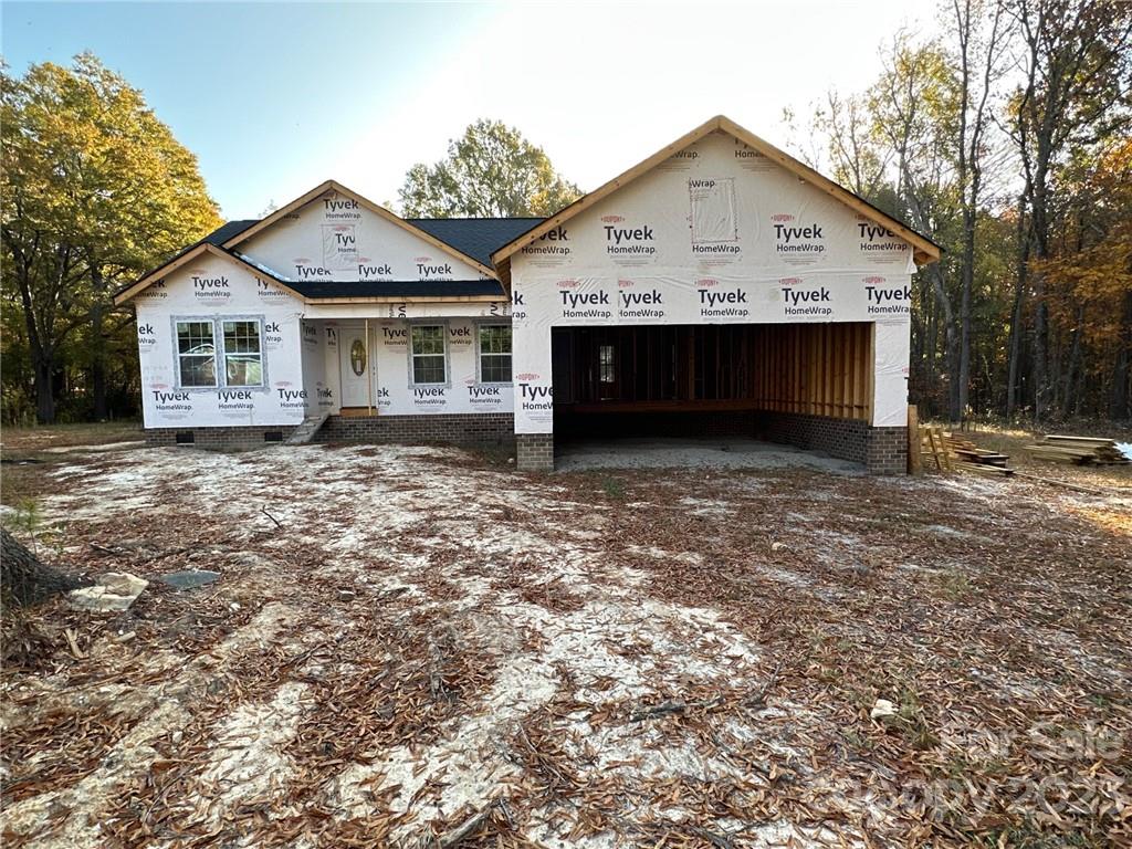 1091 Tryon Street Lancaster, SC 29720 - Photo 1 of 30 a front view of a house with a yard and garage