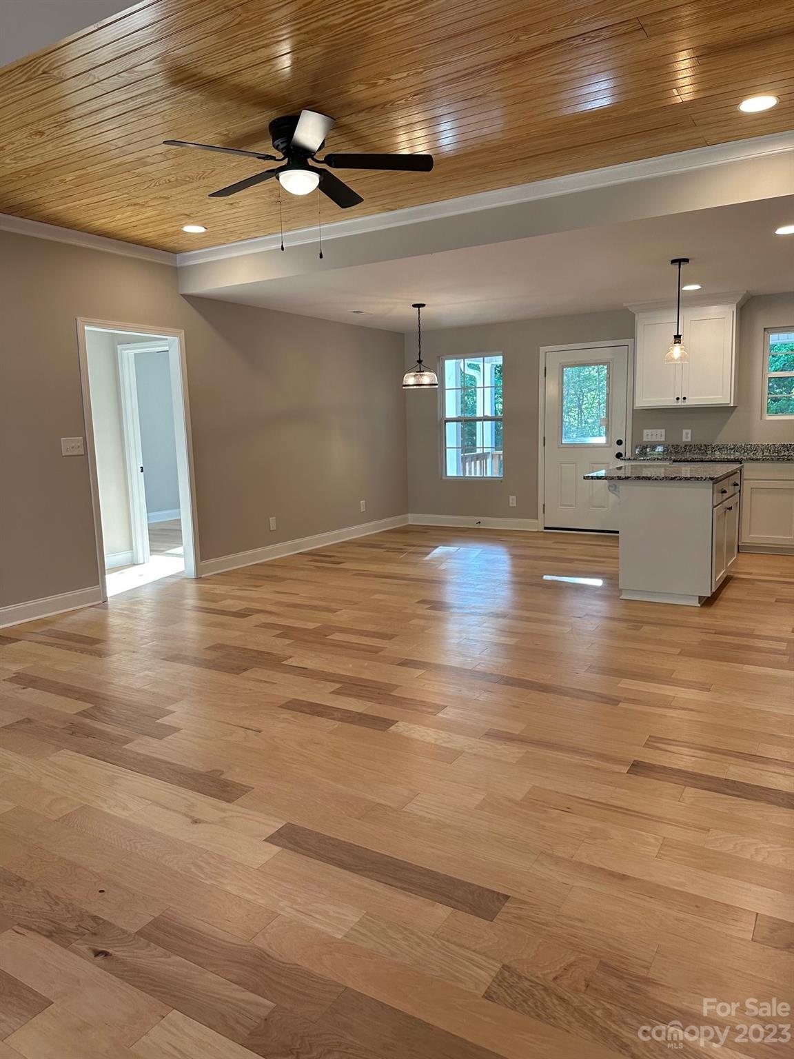 1091 Tryon Street Lancaster, SC 29720 - Photo 11 of 30 a view of an empty room with window and wooden floor