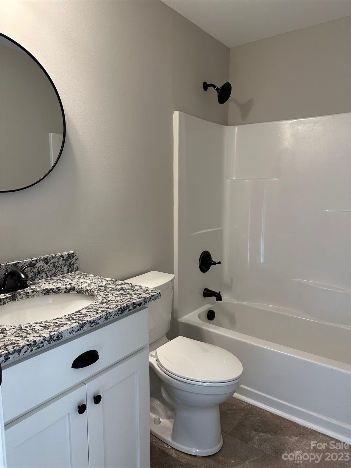 1091 Tryon Street Lancaster, SC 29720 - Photo 14 of 30 a bathroom with a granite countertop sink toilet and shower