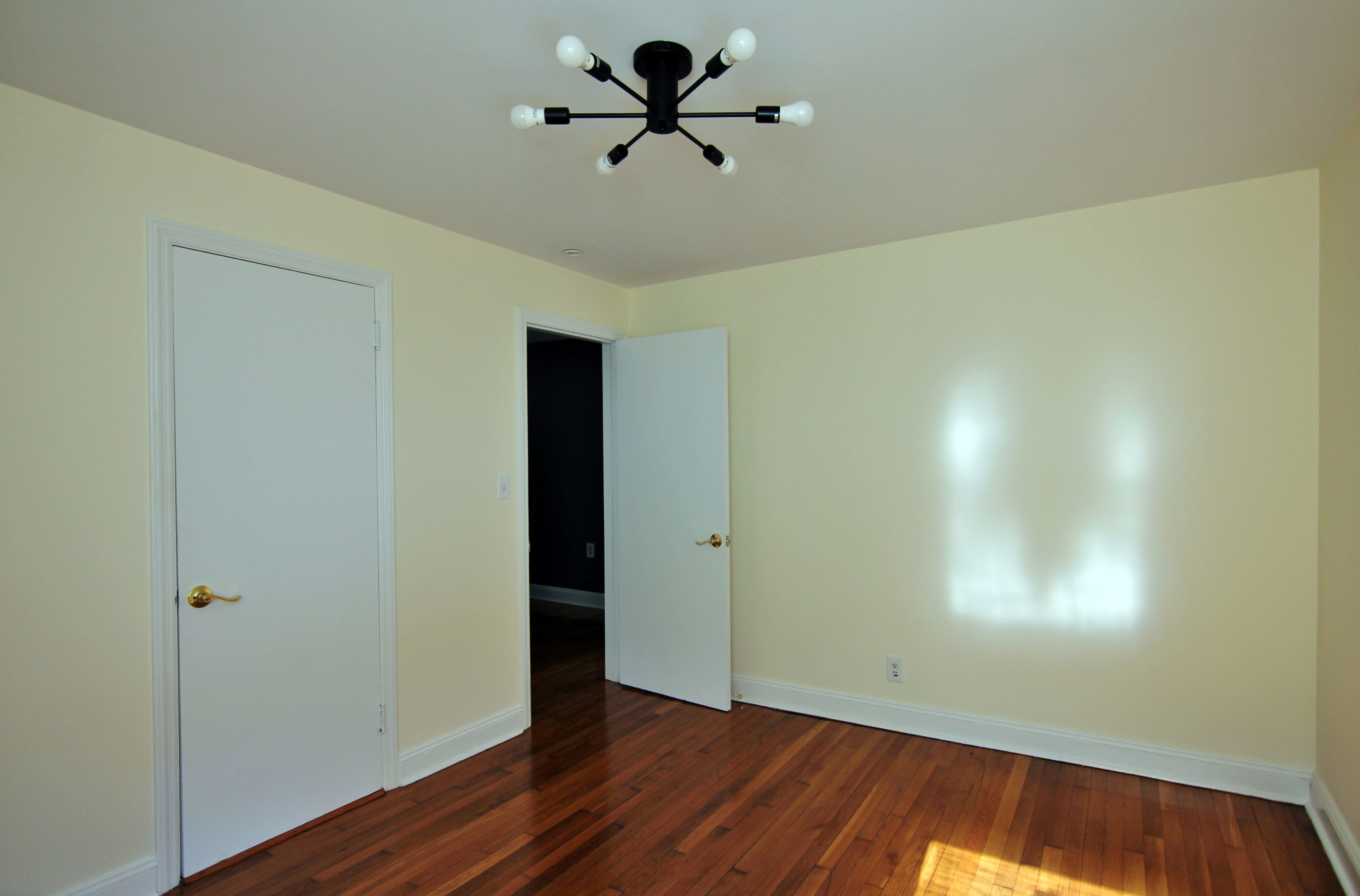 663 High Ridge Road Stamford, CT 06905 - Photo 19 of 27 a view of a room with wooden floor and a ceiling fan