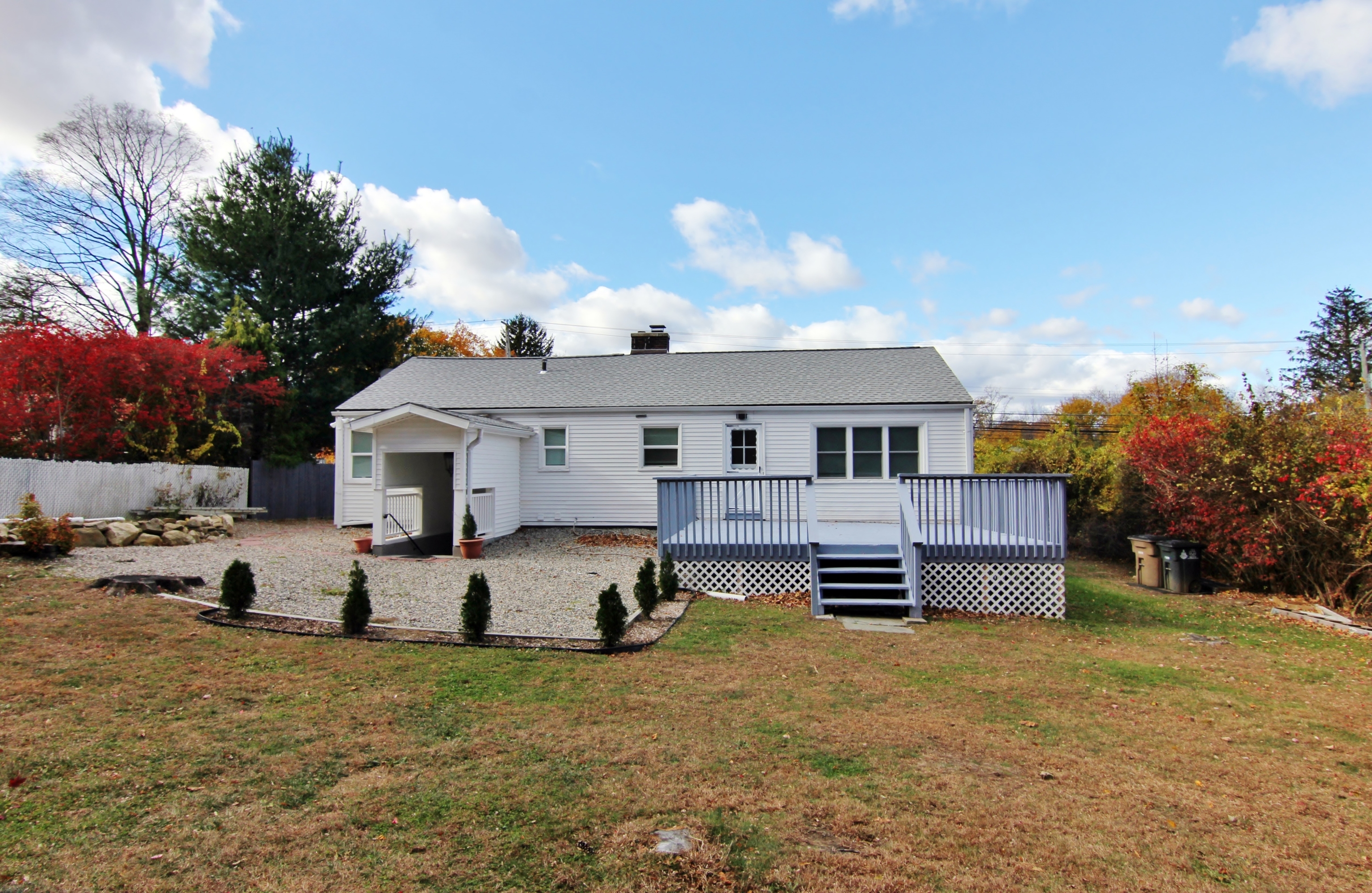 663 High Ridge Road Stamford, CT 06905 - Photo 24 of 27 a front view of a house with a yard covered in snow