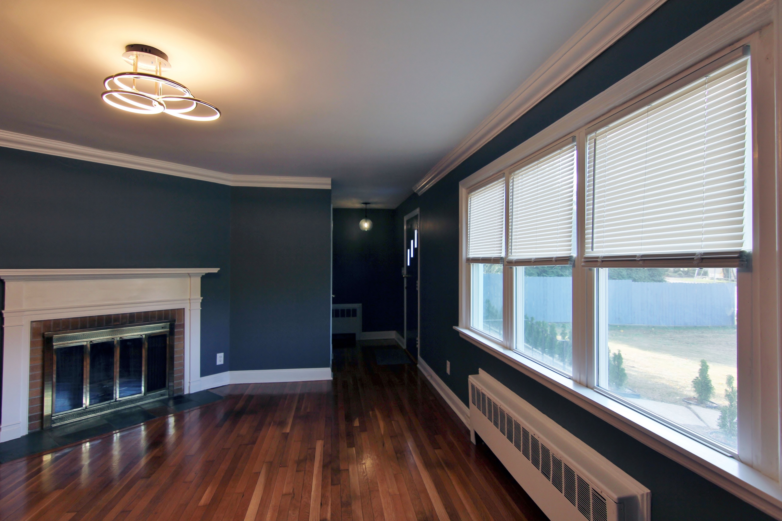 663 High Ridge Road Stamford, CT 06905 - Photo 4 of 27 a view of a room with wooden floor and a window