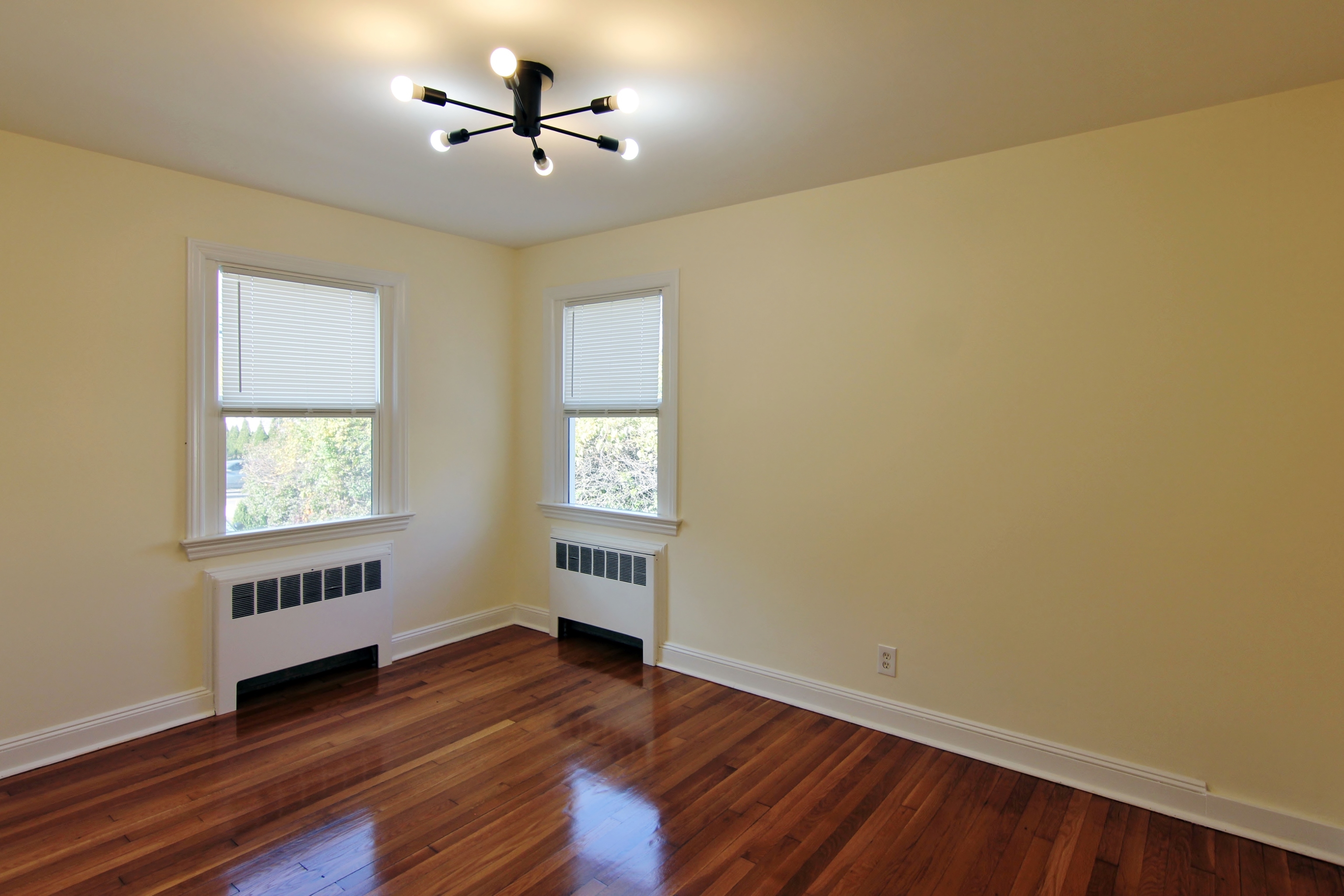663 High Ridge Road Stamford, CT 06905 - Photo 5 of 27 wooden floor in an empty room with a window