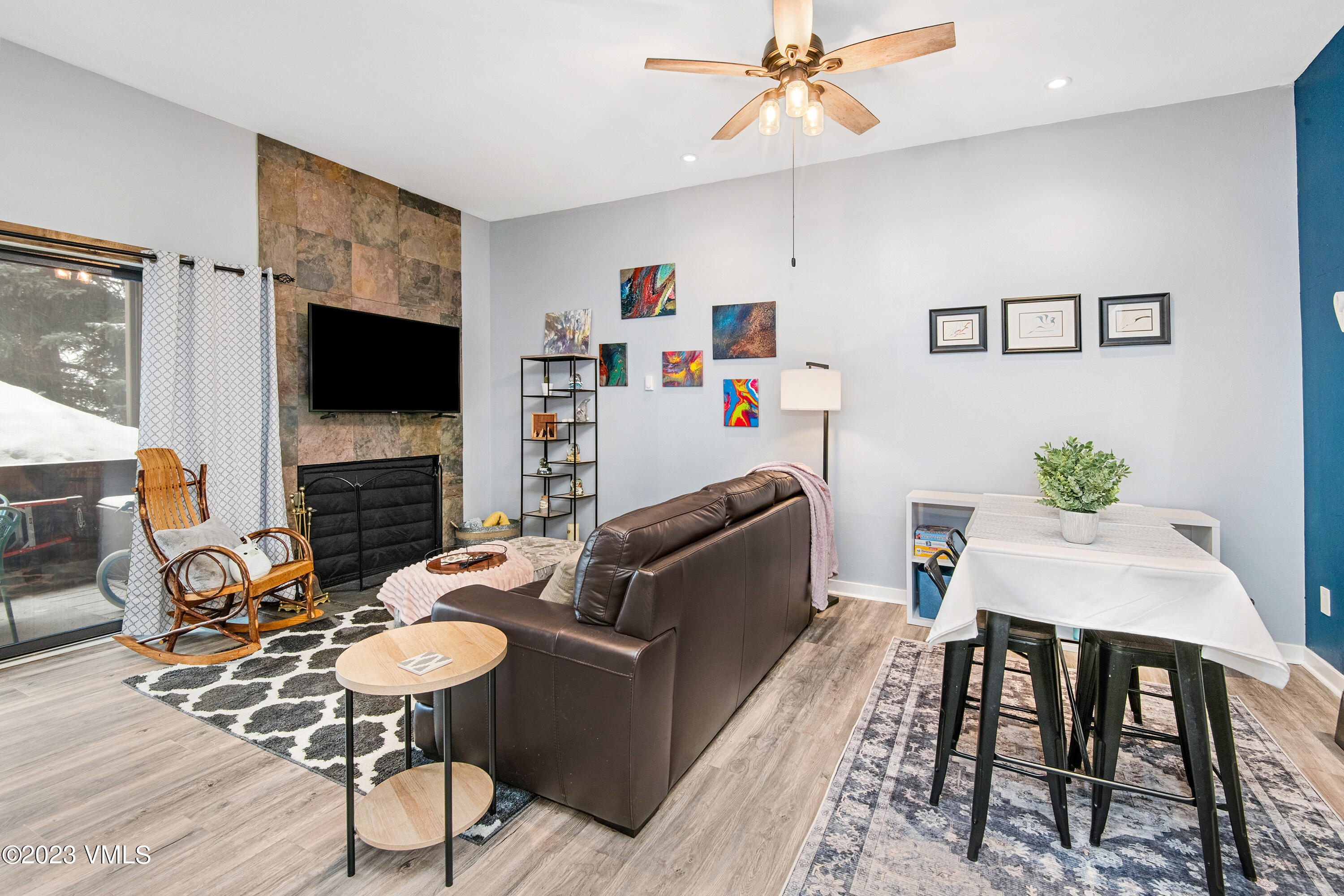 280 Gopher Road, Unit E29 Eagle-Vail, CO 81620 - Photo 15 of 22 a living room with furniture a fireplace and a flat screen tv