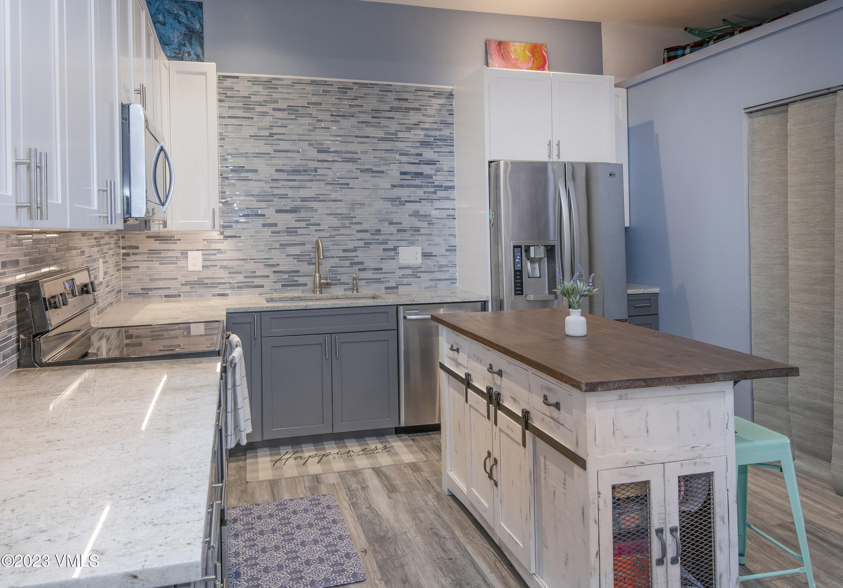 280 Gopher Road, Unit E29 Eagle-Vail, CO 81620 - Photo 16 of 22 a kitchen with stainless steel appliances granite countertop a sink stove and refrigerator