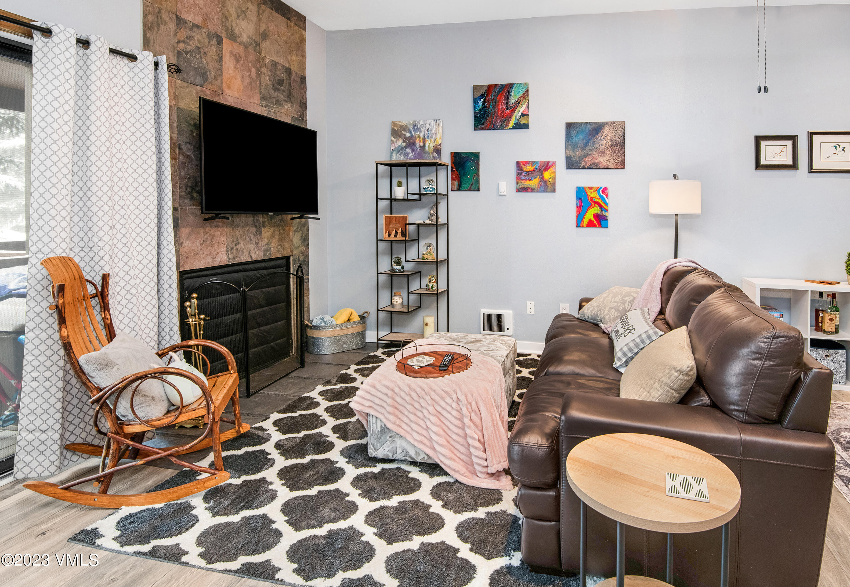 280 Gopher Road, Unit E29 Eagle-Vail, CO 81620 - Photo 4 of 22 a living room with fireplace furniture and a flat screen tv