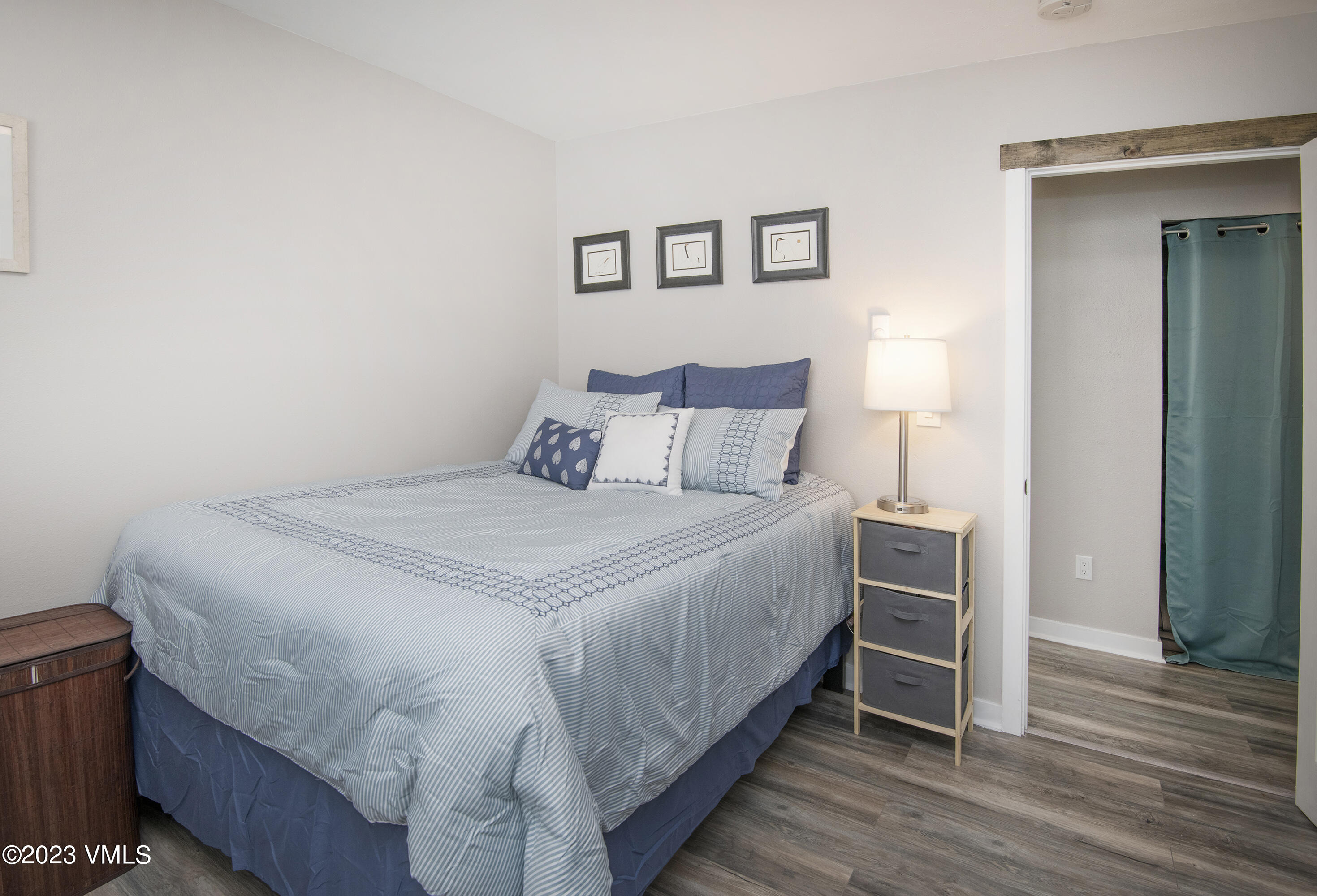 280 Gopher Road, Unit E29 Eagle-Vail, CO 81620 - Photo 8 of 22 a bedroom with a bed and wooden floor