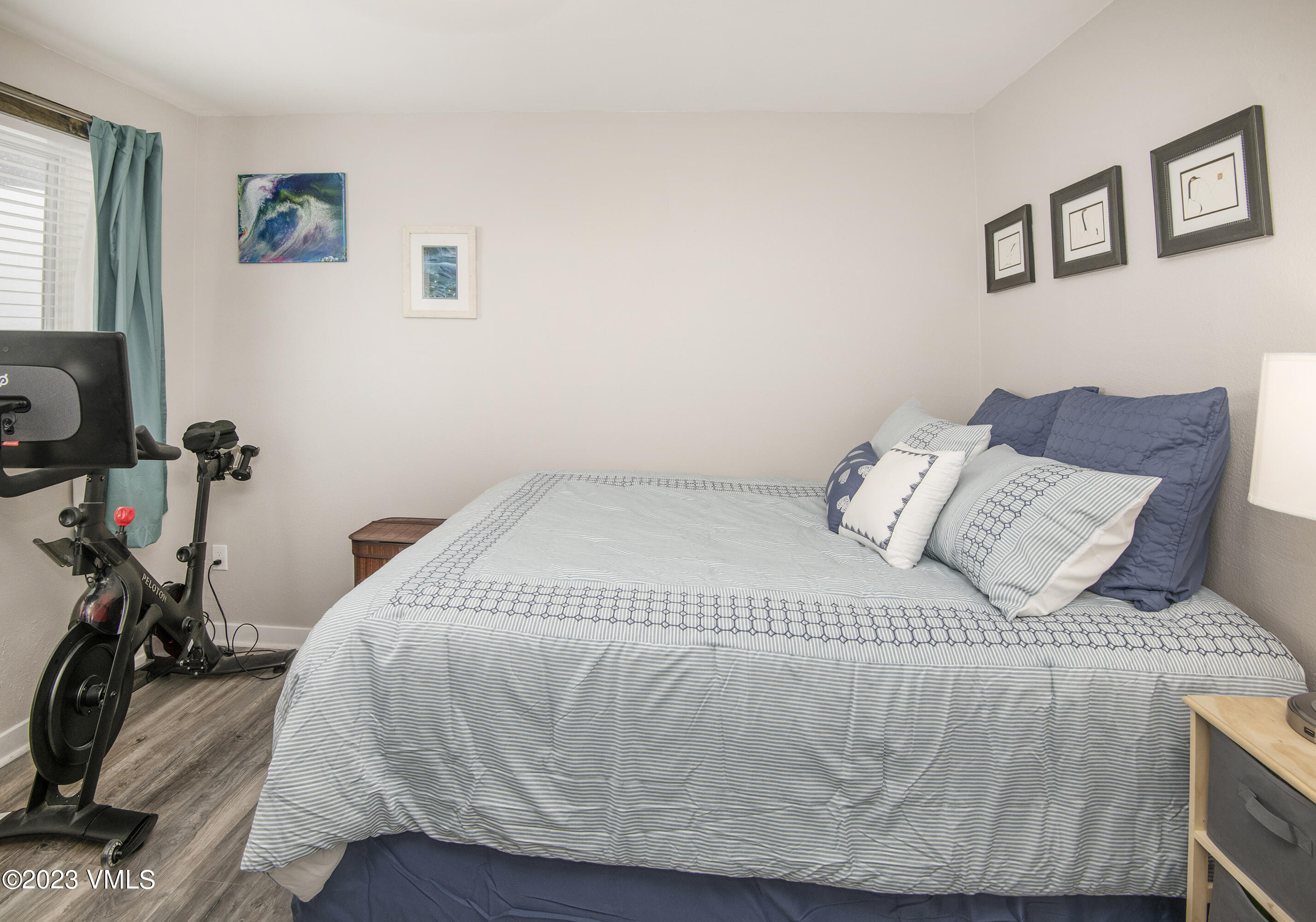 280 Gopher Road, Unit E29 Eagle-Vail, CO 81620 - Photo 9 of 22 a bed sitting in a bedroom next to a window