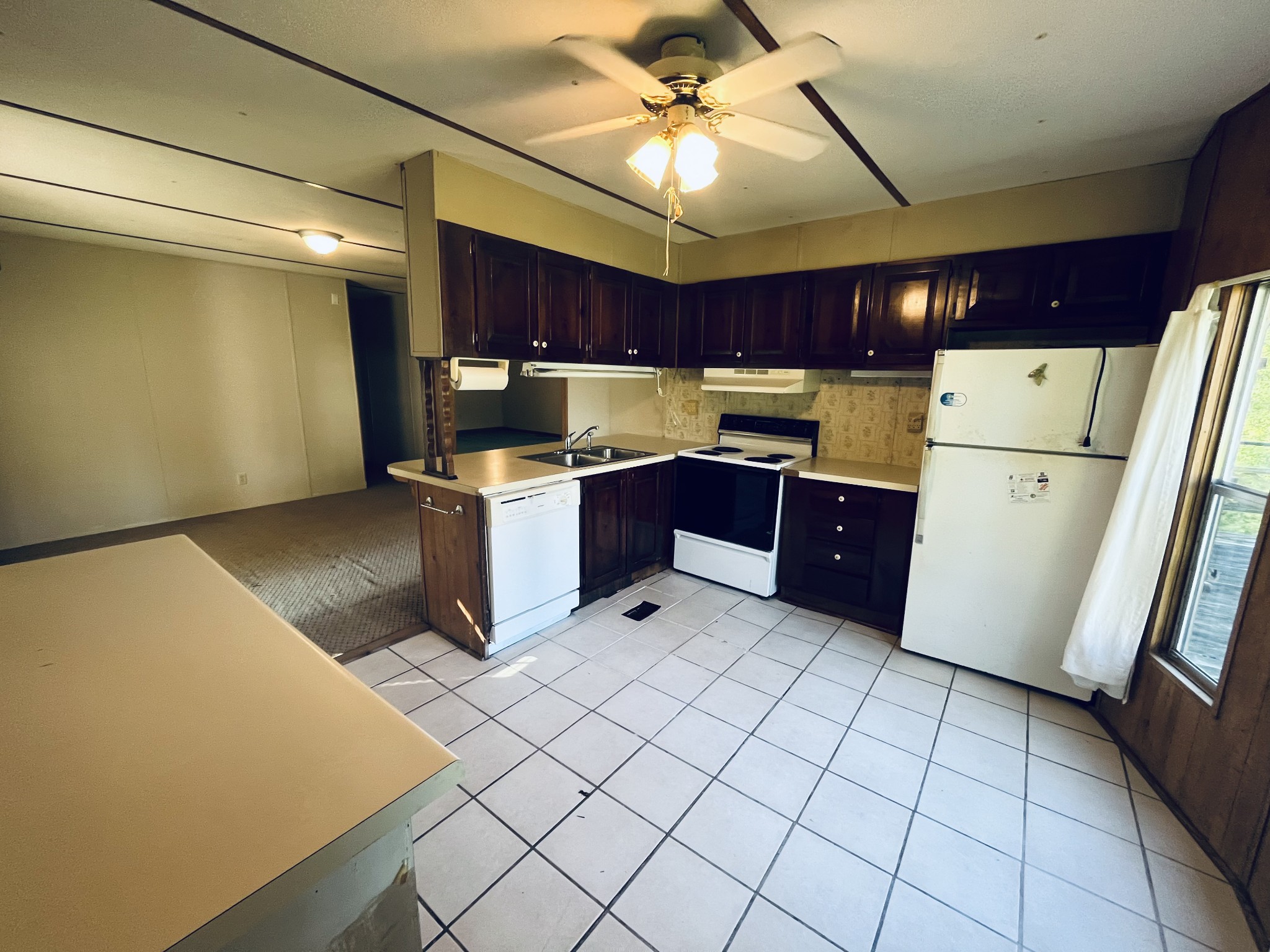 294 Ridgeway Drive Sugar Tree, TN 38380 - Photo 21 of 28 a kitchen with a cabinets and white appliances